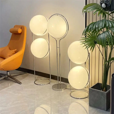 Delord Chrome Floor Lamp — Sculptural Acrylic Globe Light