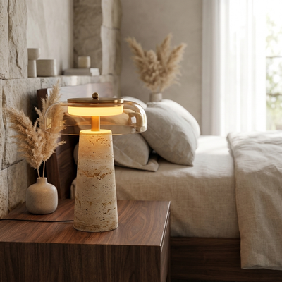 Travertine mushroom table lamp glowing on a walnut nightstand in a modern minimalist bedroom
