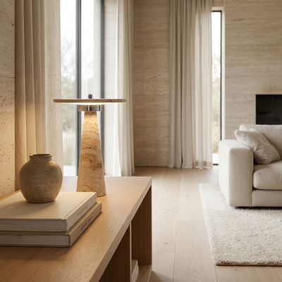 Travertine mushroom lamp on an oak console with books and a vase