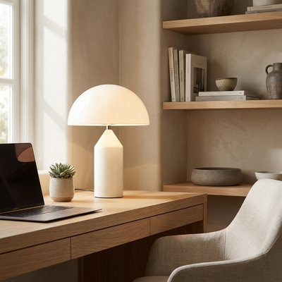 Mushroom dome LED lamp glowing on a study desk