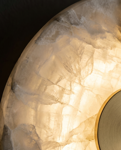 Macro detail of backlit natural alabaster veining with brass hub
