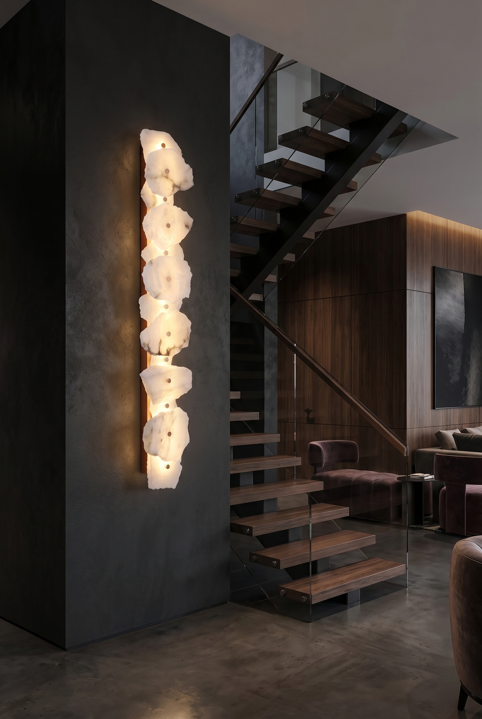 Tall alabaster linear sconce beside a modern staircase