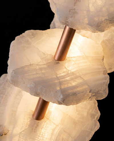 Macro detail of backlit alabaster slabs on a copper bar