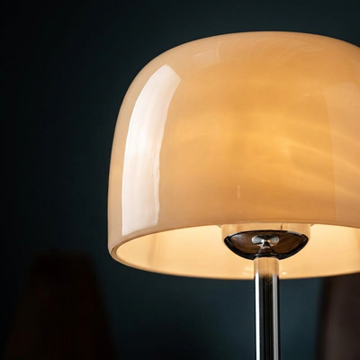 Close-up of the glowing amber dome shade